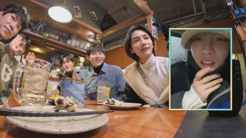 居酒屋で楽しんでいるグループの画像。グラスを片手に笑顔を見せる人や、窓越しに話す人の姿が映っています。